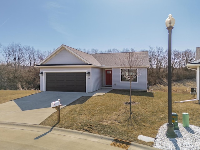 single story home with a front lawn, an attached garage, and driveway