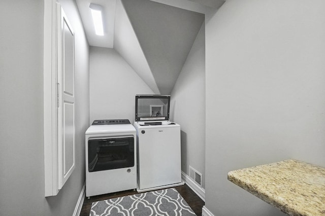 laundry room featuring visible vents, baseboards, washer and clothes dryer, laundry area, and dark wood-style floors