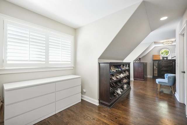 interior space featuring recessed lighting, baseboards, lofted ceiling, and wood finished floors