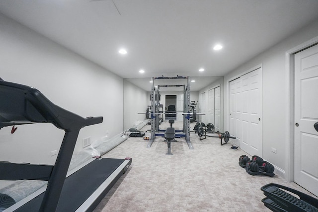 exercise area featuring recessed lighting, visible vents, baseboards, and carpet