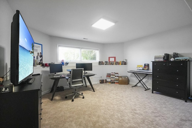 carpeted office space featuring baseboards