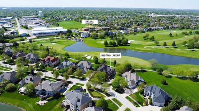 birds eye view of property with a residential view, a water view, and golf course view