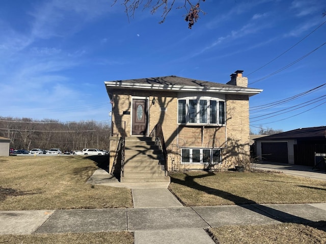 view of front of property with brick siding, a chimney, and a front lawn