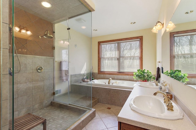 bathroom with a sink, a garden tub, a stall shower, and tile patterned floors