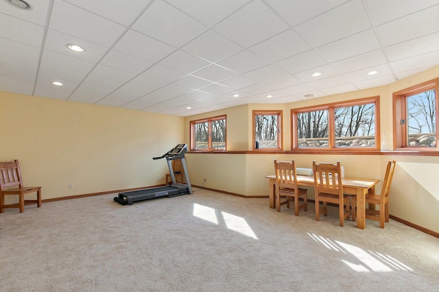 exercise room with a wealth of natural light, baseboards, recessed lighting, and carpet flooring