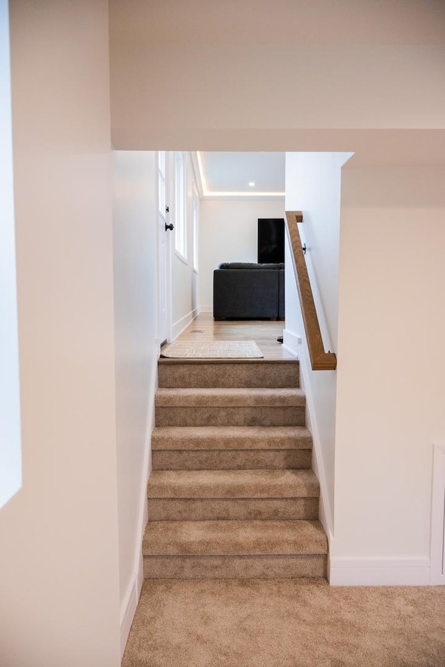 staircase with carpet and baseboards