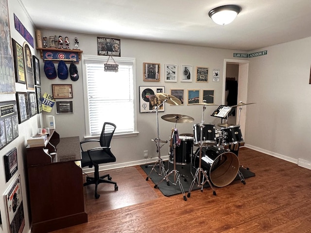 office space with baseboards and wood finished floors