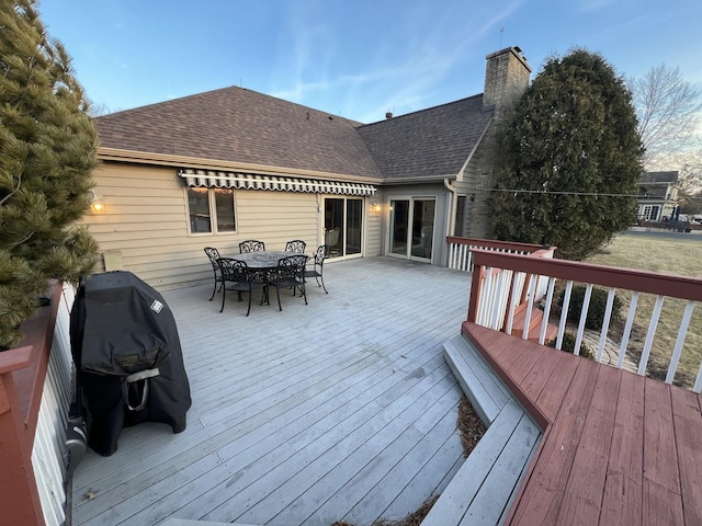 deck featuring outdoor dining area