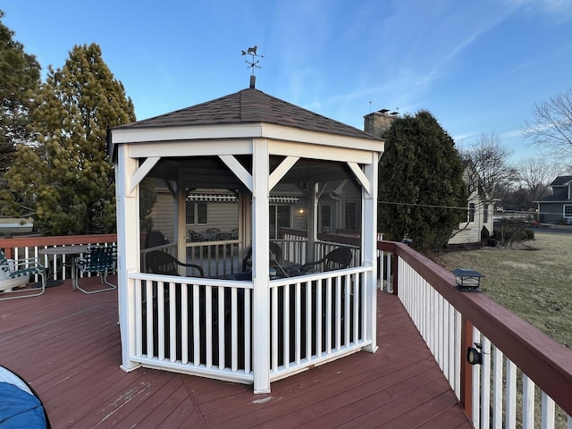 wooden terrace featuring a gazebo