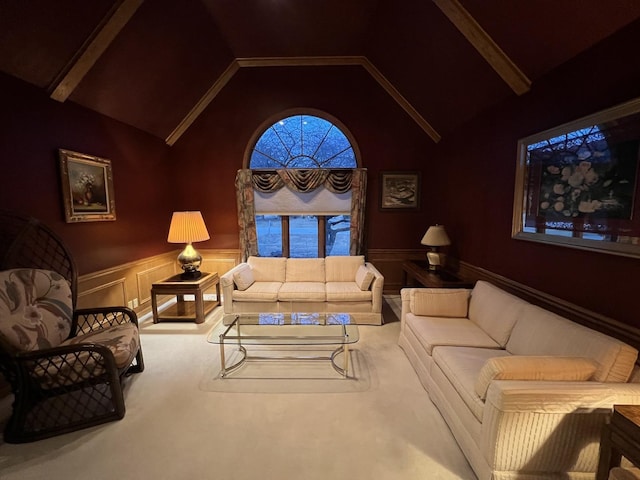 living room featuring a wainscoted wall and vaulted ceiling