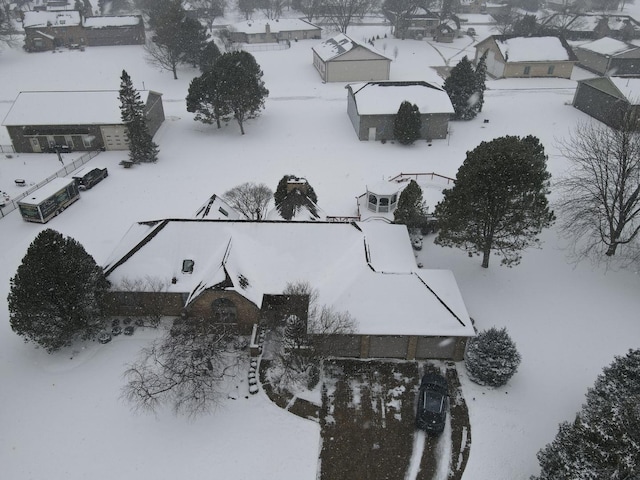 snowy aerial view featuring a residential view