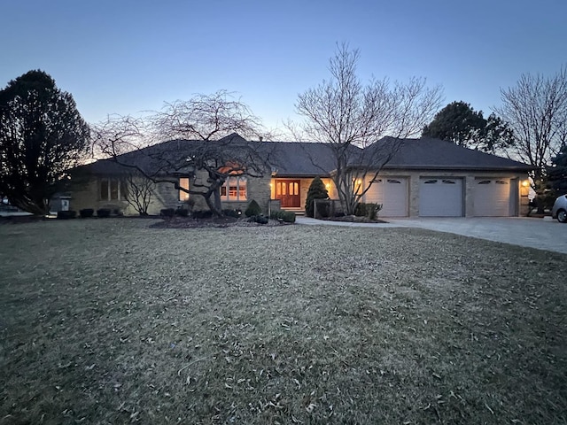 view of front of home with a garage and driveway