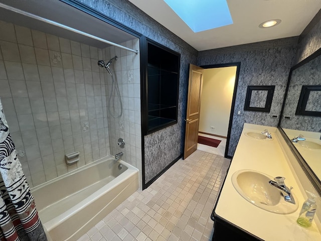 bathroom with a sink, wallpapered walls, and shower / bath combination with curtain