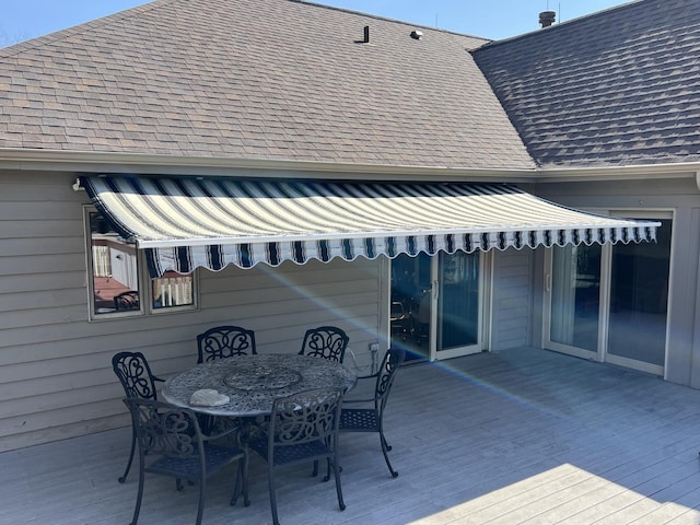 wooden deck featuring outdoor dining space