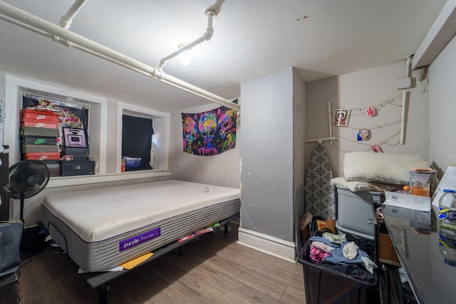 bedroom featuring wood finished floors