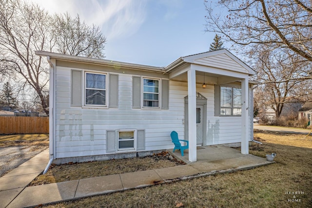 view of front of property featuring fence