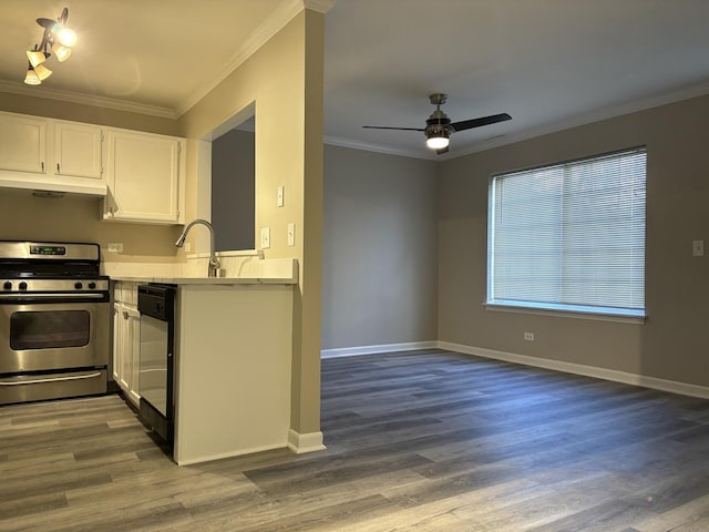 kitchen featuring white cabinets, dishwasher, light countertops, crown molding, and gas stove