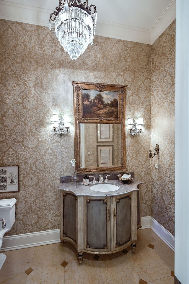 half bath featuring baseboards, wallpapered walls, crown molding, toilet, and a chandelier