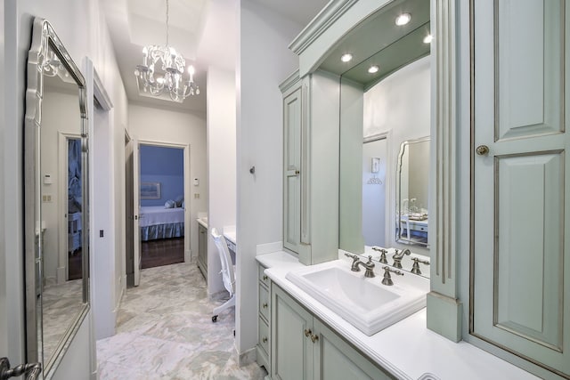 ensuite bathroom with ensuite bath, marble finish floor, and vanity