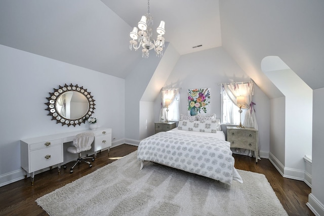 bedroom featuring vaulted ceiling, wood finished floors, visible vents, and baseboards