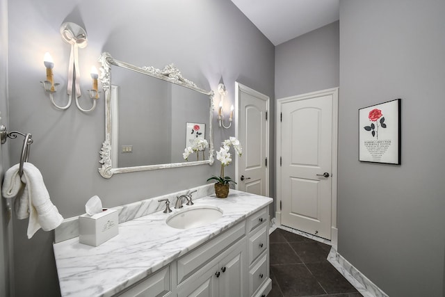 bathroom featuring tile patterned floors, vanity, and baseboards