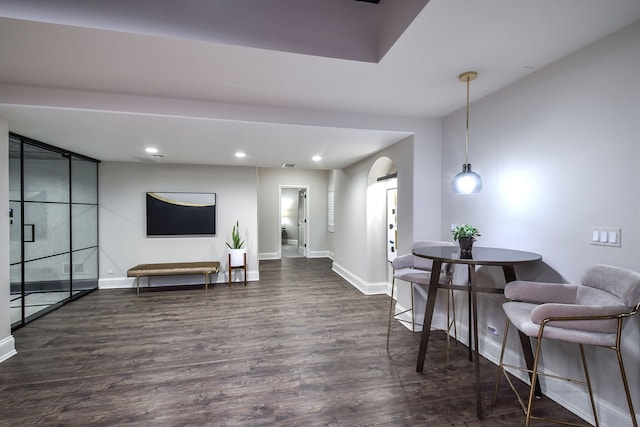 interior space with recessed lighting, visible vents, baseboards, and dark wood-style flooring