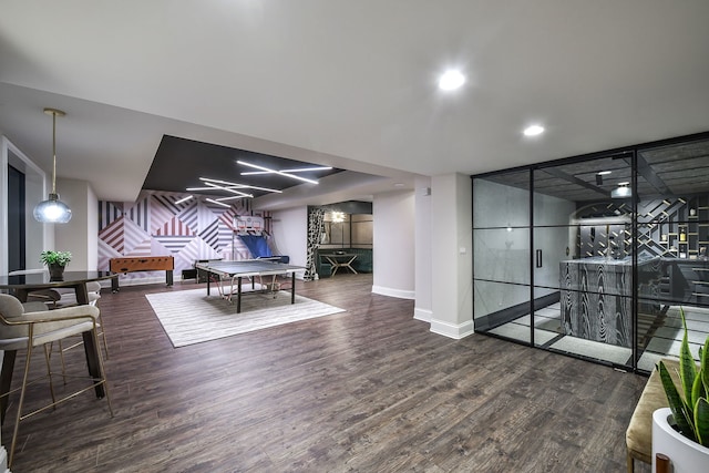 rec room featuring recessed lighting, baseboards, and wood finished floors