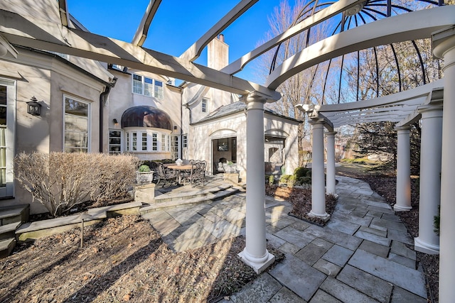 view of patio / terrace featuring outdoor dining space and a pergola