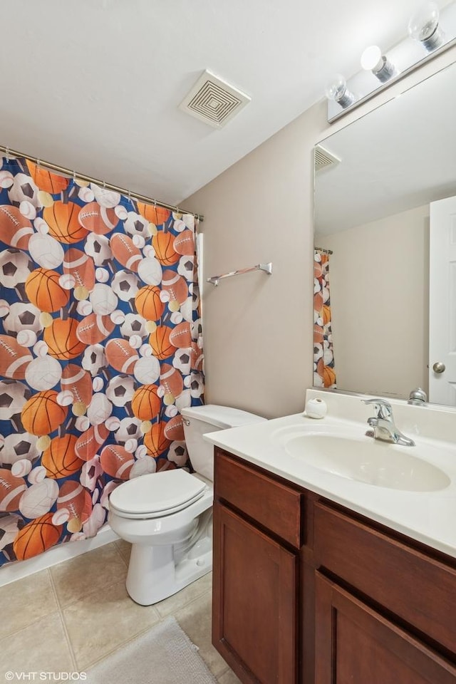 full bathroom featuring visible vents, toilet, vanity, and tile patterned flooring