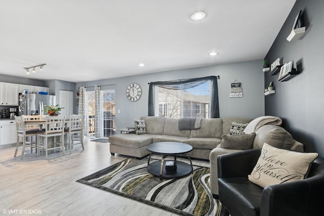 living area with recessed lighting and light wood-type flooring