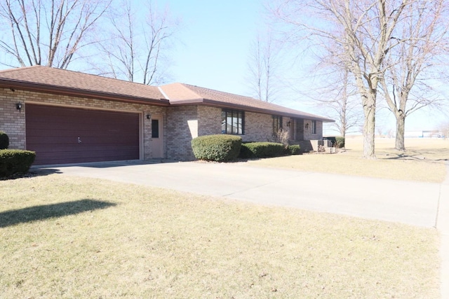 ranch-style home with brick siding, driveway, a front lawn, and a garage