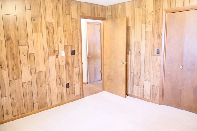 spare room with wooden walls