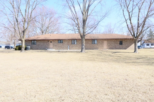 rear view of property with brick siding