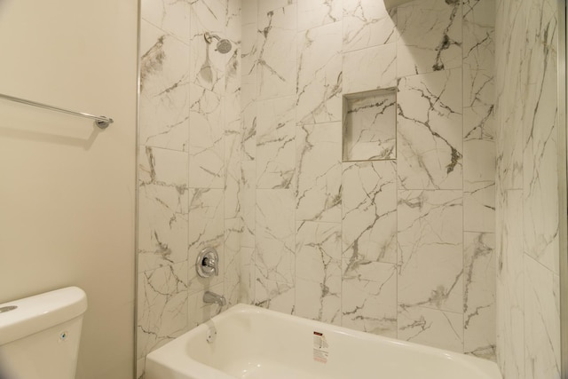 full bathroom featuring bathing tub / shower combination and toilet