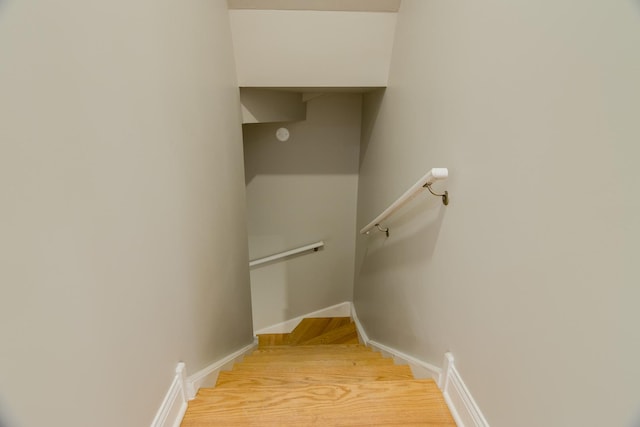 staircase featuring baseboards