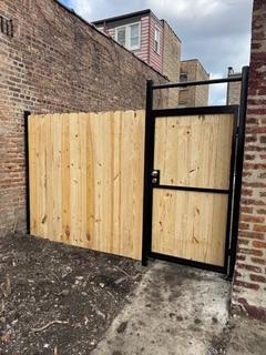 view of gate featuring fence