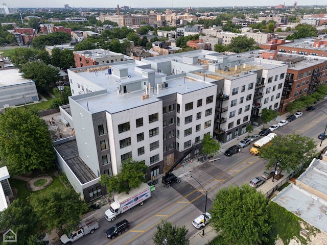 birds eye view of property with a view of city