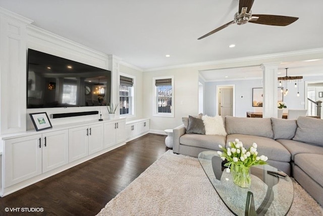 living room featuring a ceiling fan, dark wood-style floors, ornate columns, recessed lighting, and crown molding