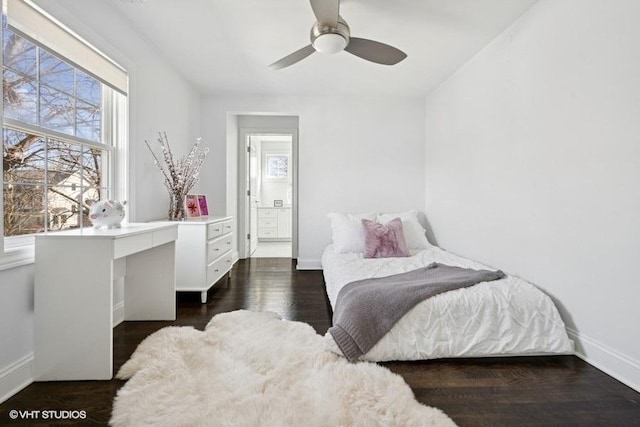 bedroom with baseboards, a ceiling fan, and dark wood-style flooring