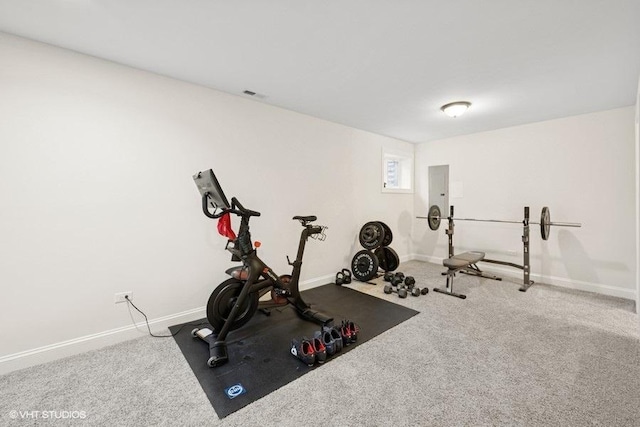 workout area with visible vents, baseboards, and carpet