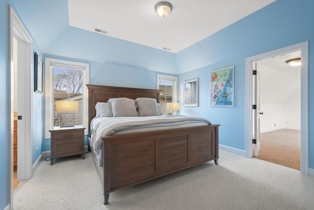 bedroom featuring light carpet, visible vents, and lofted ceiling