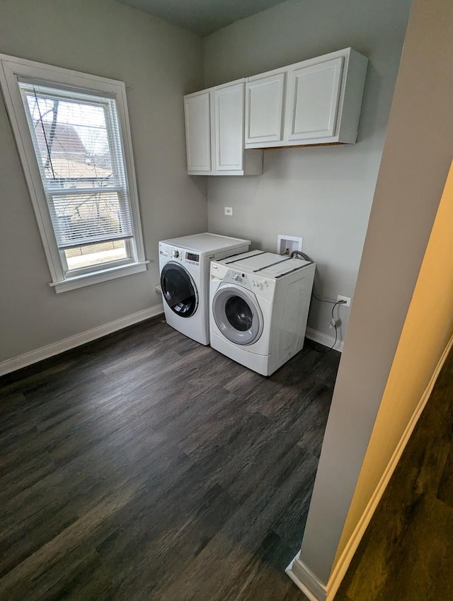 laundry area with washer and dryer, baseboards, cabinet space, and dark wood-style floors