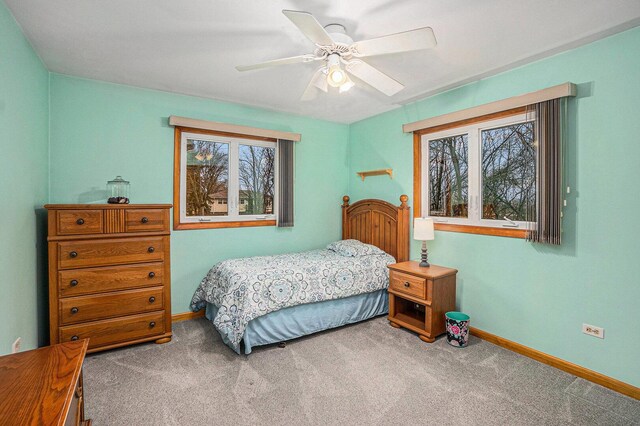 bedroom featuring a ceiling fan, baseboards, and carpet floors