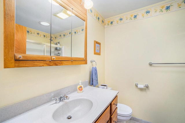 bathroom with a shower, toilet, and vanity