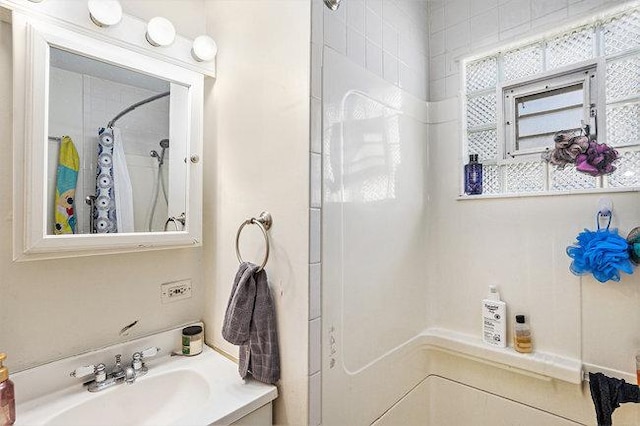 full bath with vanity and a shower with curtain