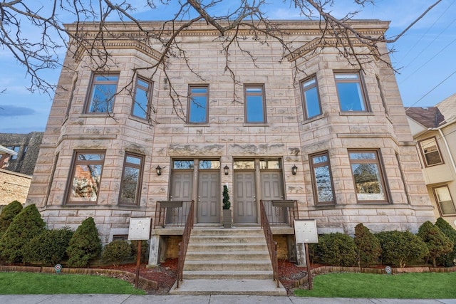 view of front of home with stone siding