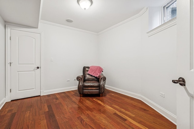 unfurnished room with ornamental molding, baseboards, and wood finished floors