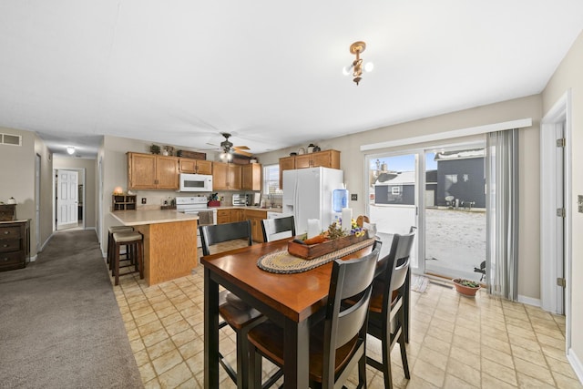 606 Effie Dr, Earlville, IL 60518 - dining room featuring ceiling fan and baseboards