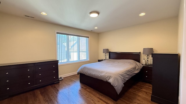 bedroom with recessed lighting, visible vents, baseboards, and dark wood-style flooring