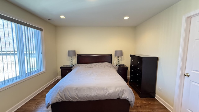 bedroom featuring recessed lighting, visible vents, baseboards, and dark wood finished floors